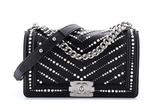 Chanel Boy Flap Bag Pearl Embellished Chevron Calfskin Old Medium: Chanel Boy Bag – Black Studded Chevron Leather with Silver Hardware Make an edgy yet sophisticated statement with this Chanel Boy Bag. Crafted from black chevron-quilted leather, this striking