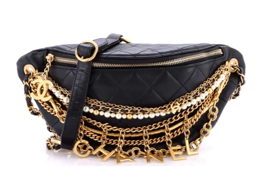 Chanel All About Chains Waist Bag Quilted Lambskin: Chanel Waist Bag – Black Quilted Lambskin with Gold Chains & CharmsMake a bold statement with this Chanel Waist Bag, a standout accessory that blends streetwear edge with classic Chanel luxury.