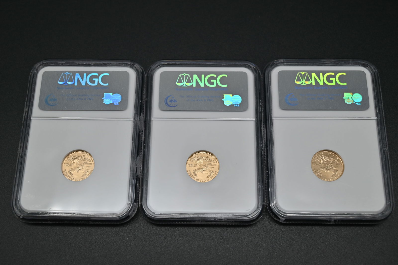 USA 3 x 1/10 Unze Gold, 5 Dollars NGC - 10