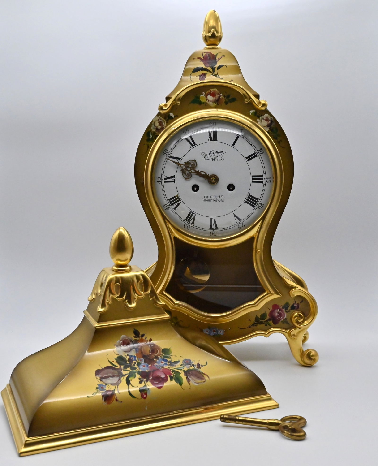 Du Chateau Deluxe Dugena Geneve Uhr mit Konsole: Du Chateau Deluxe Dugena Geneve Uhr mit Konsole Du Chateau Deluxe Dugena Geneve Uhr mit KonsoleMaße: 44 x 24 x 10 cmMit handgemalten BlumenDu Chateau Deluxe Dugena Geneve clock with