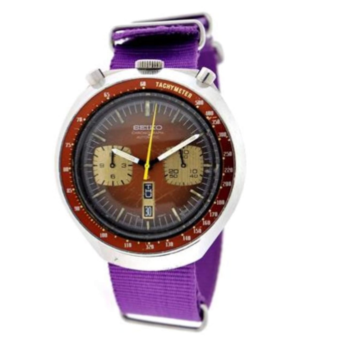 Seiko Stainless Steel Chronograph with Purple NATO Strap: Seiko Stainless Steel Chronograph with Purple NATO Strap This Seiko Stainless Steel Chronograph Watch is a stylish timepiece that combines functionality with elegance. It features a durable stainless