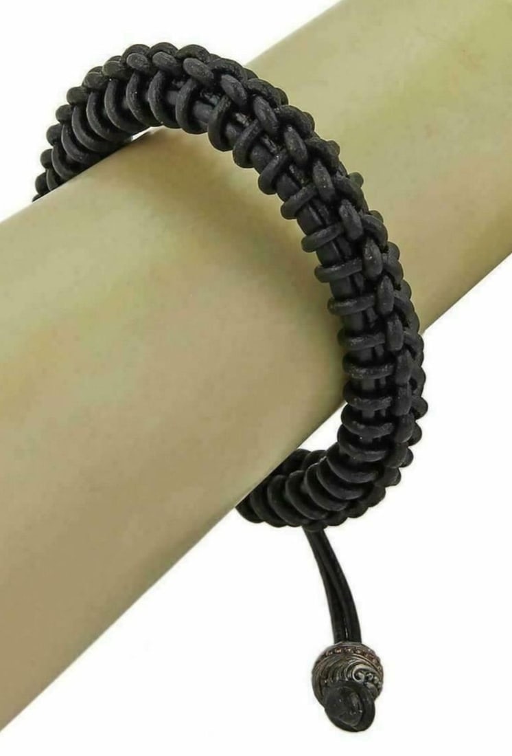 Stephen Webster No Regrets Black Rhodium Silver Leather Bracelet: Stephen Webster No Regrets Black Rhodium Silver Leather Bracelet This Stephen Webster "No Regrets" bracelet combines modern luxury with edgy style. Crafted with a thick woven black leather band, it fe