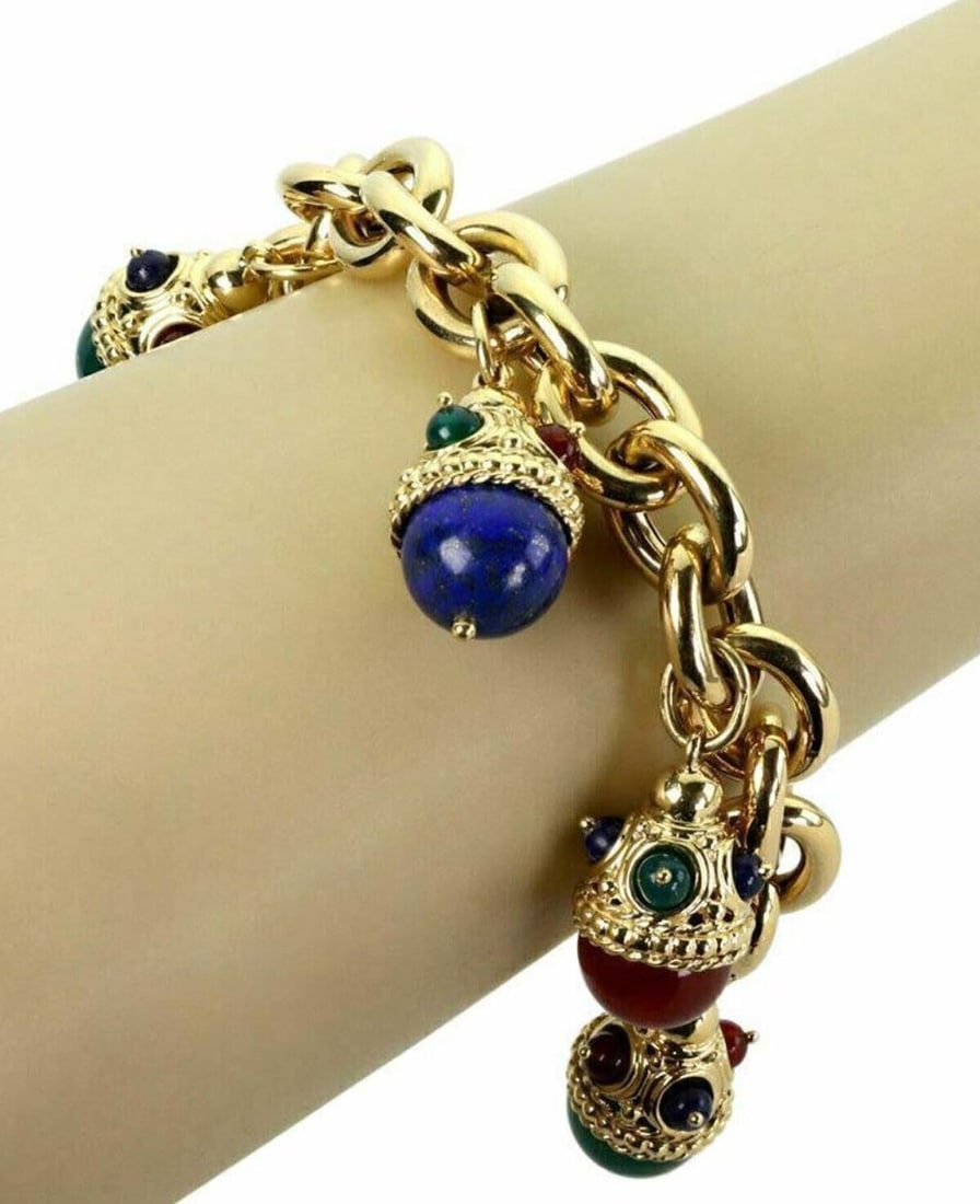 Legnazzi 18k Gold Multi-Color Egg Charms Bracelet 5 Charms 7.75 Inches: Legnazzi 18k Gold Multi-Color Egg Charms Bracelet 5 Charms 7.75 Inches Experience the elegance of the Legnazzi Multi-Color Gems 18k Yellow Gold 5 Fancy Egg Charms Chain Bracelet. This captivating vint