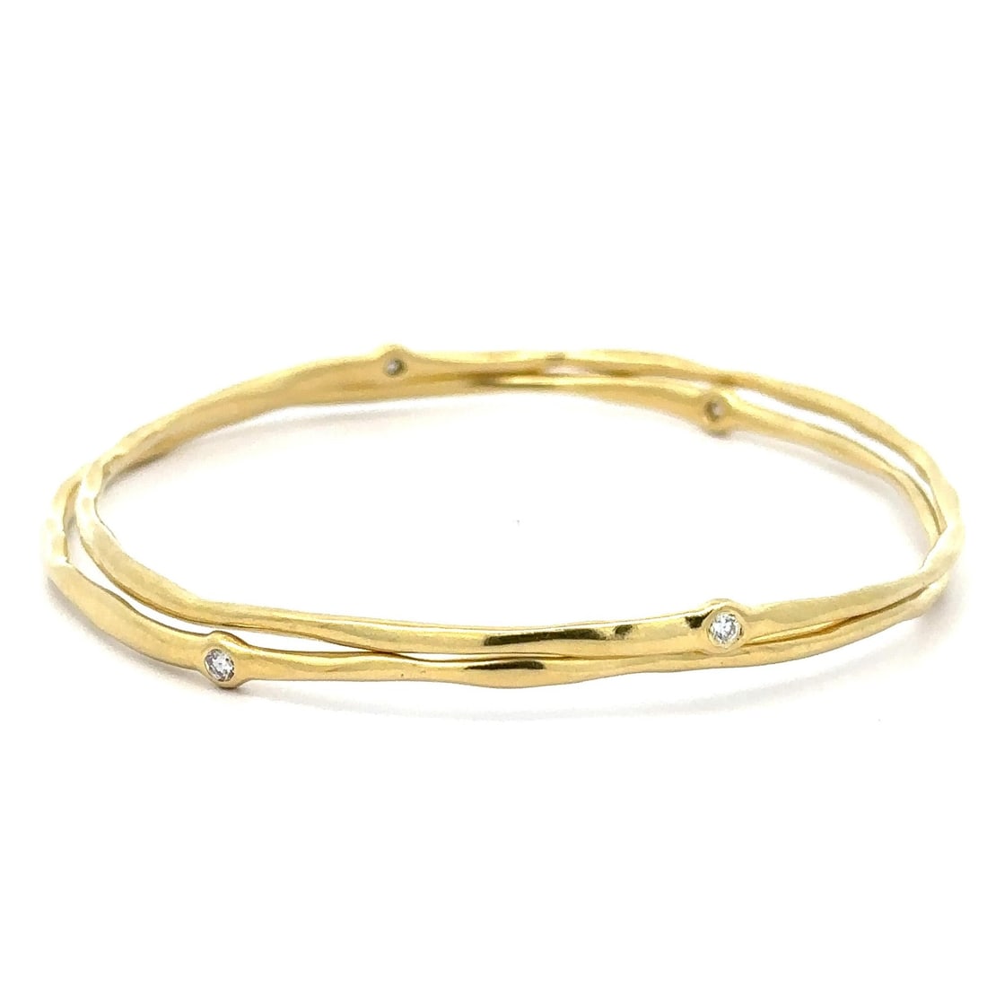 18K Yellow Gold Pair of 2 Diamond Bezel Slip On Bangles: 18K Yellow Gold Pair of 2 Diamond Bezel Slip On Bangles This exquisite pair of slip-on bangle bracelets is crafted from solid 18k yellow gold and features four natural genuine diamonds. The round bril
