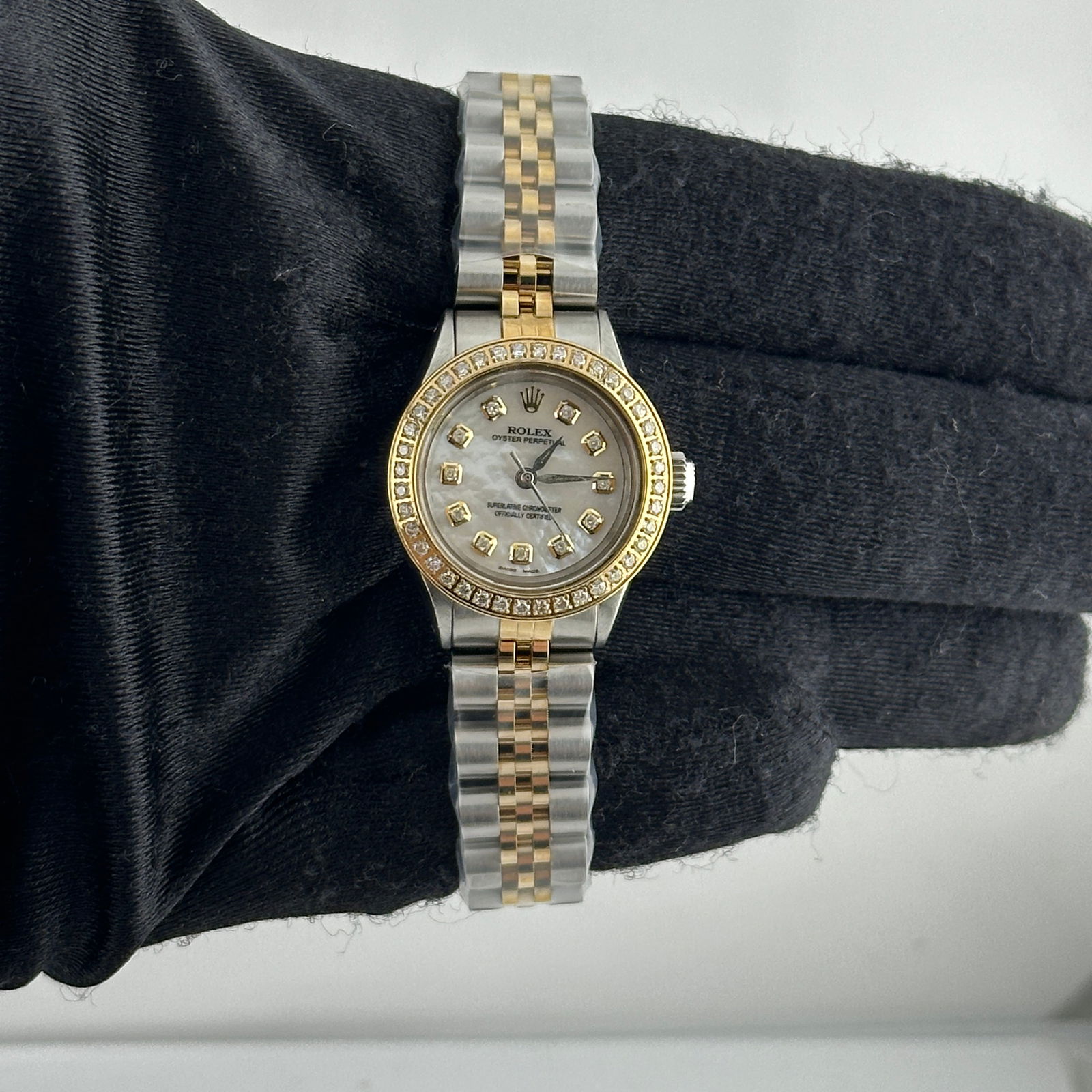 Rolex Oyster Perpetual Ladies Diamond Dial Jubilee Ref 6618: Rolex Oyster Perpetual Ladies Diamond Dial Jubilee Ref 6618 This exquisite Rolex Oyster Perpetual is designed for ladies, featuring a stunning Aftermarket White Mother of Pearl (MOP) diamond dial that
