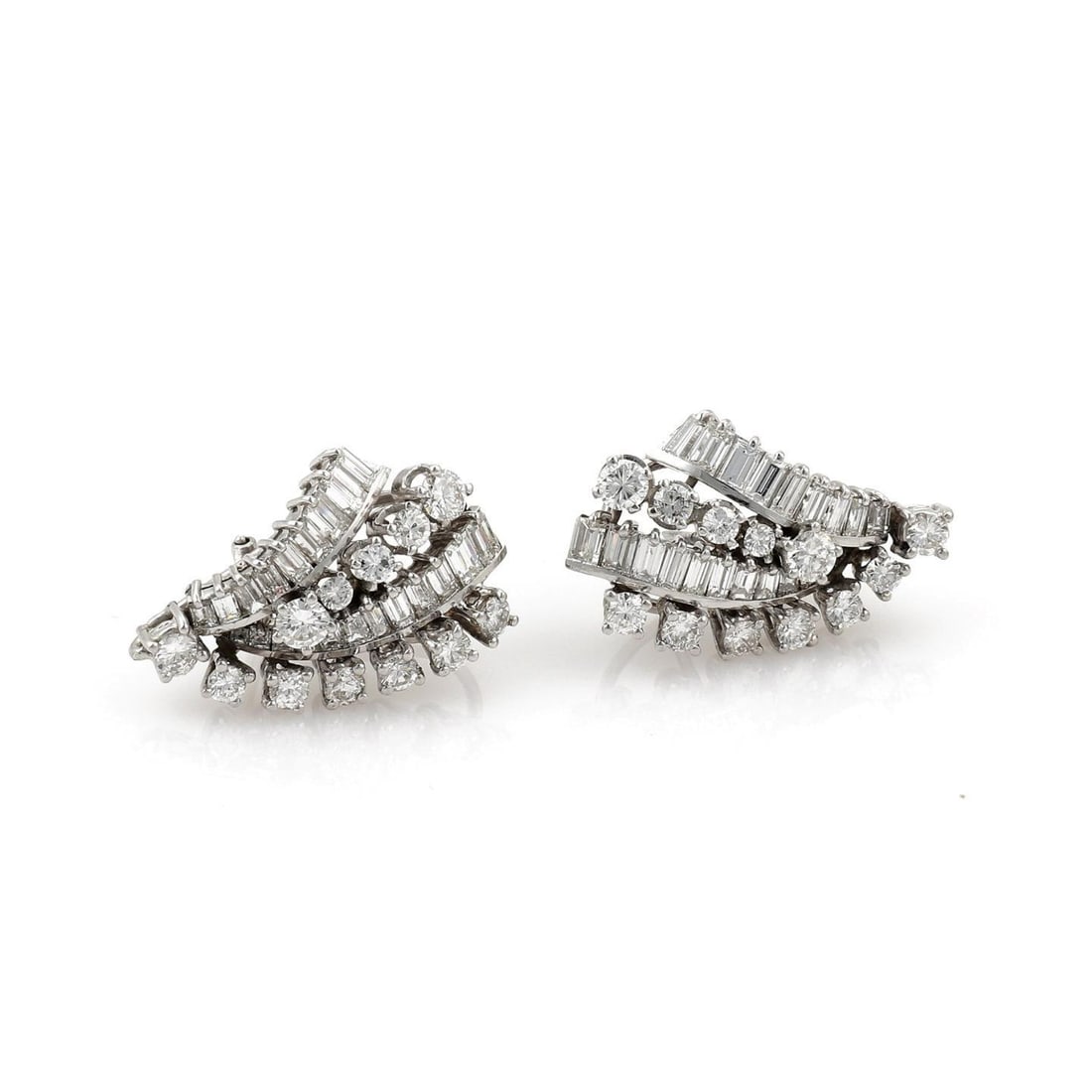 Vintage 5ct Diamond V Shape Platinum Clip Earrings: Vintage 5ct Diamond V Shape Platinum Clip Earrings This stunning pair of vintage earrings showcases a sophisticated design crafted from polished platinum. Featuring four rows of alternating baguette a