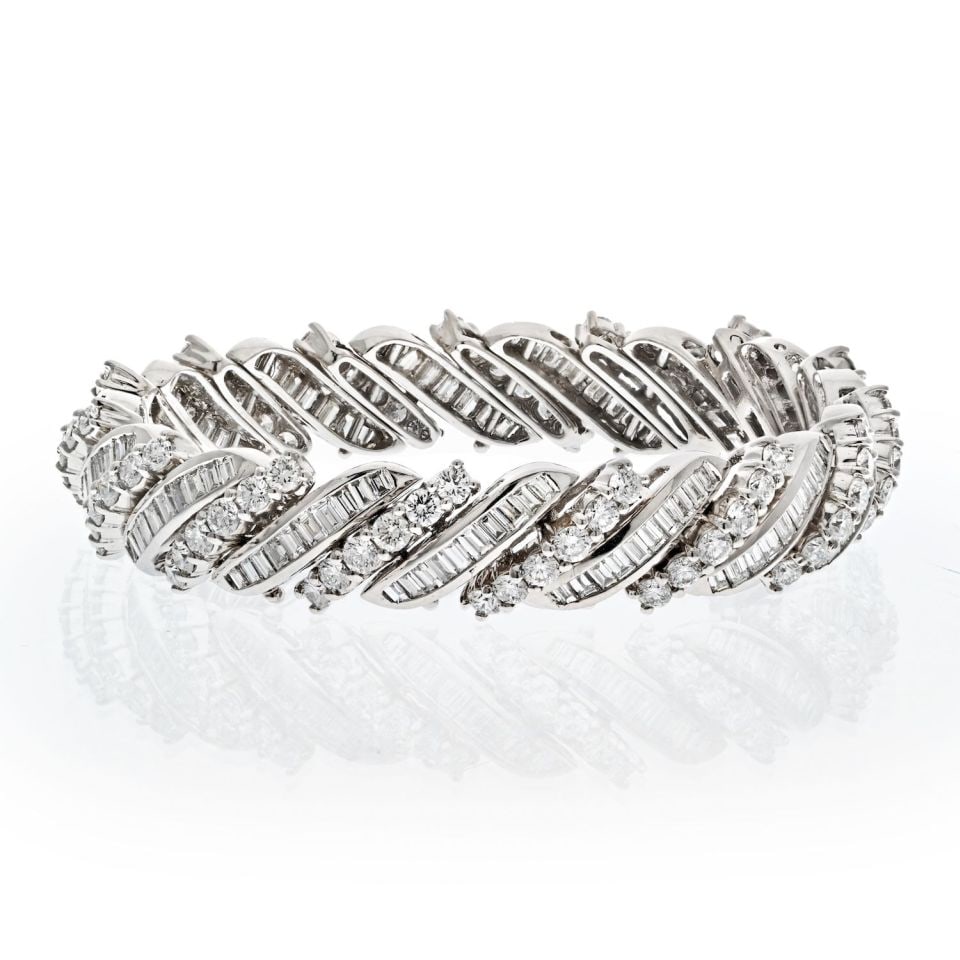 Midcentury Platinum Bracelet 16.50ct Round Baguette Diamonds: Midcentury Platinum Bracelet 16.50ct Round Baguette Diamonds This exquisite midcentury bracelet features a stunning combination of round and baguette cut diamonds, totaling an impressive 16.50 carats.