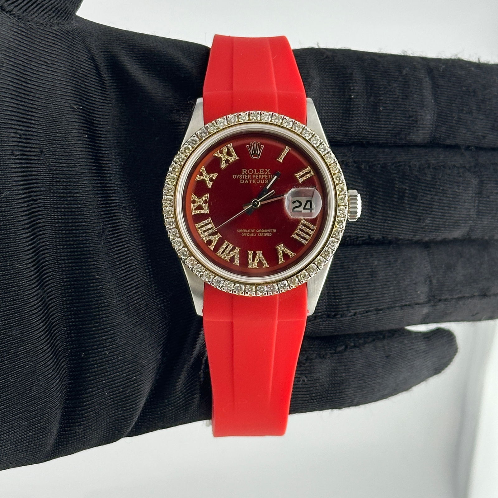 Rolex Datejust 1601/3 Red Roman Diamond Dial Aftermarket Rubber Bracelet: Rolex Datejust 1601/3 Red Roman Diamond Dial Aftermarket Rubber Bracelet This exquisite Rolex Datejust watch features a striking brown dial adorned with Roman numerals, adding a touch of sophisticatio