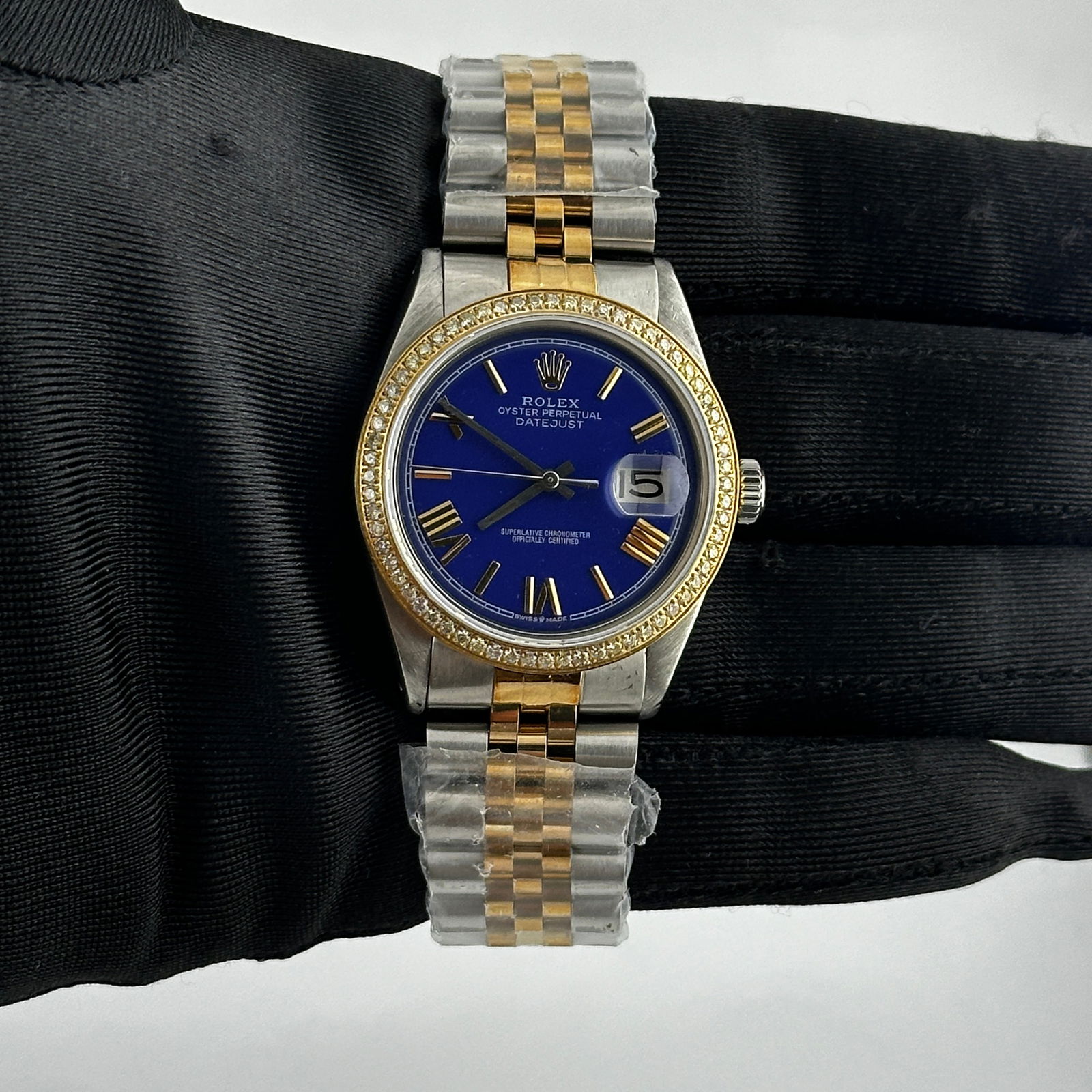 Rolex Datejust 1601 Aftermarket Blue Roman Dial Pave Diamond Jubilee Bracelet: Rolex Datejust 1601 Aftermarket Blue Roman Dial Pave Diamond Jubilee Bracelet This exquisite Rolex Datejust features a striking Aftermarket Blue Roman Stick dial that beautifully complements its pave