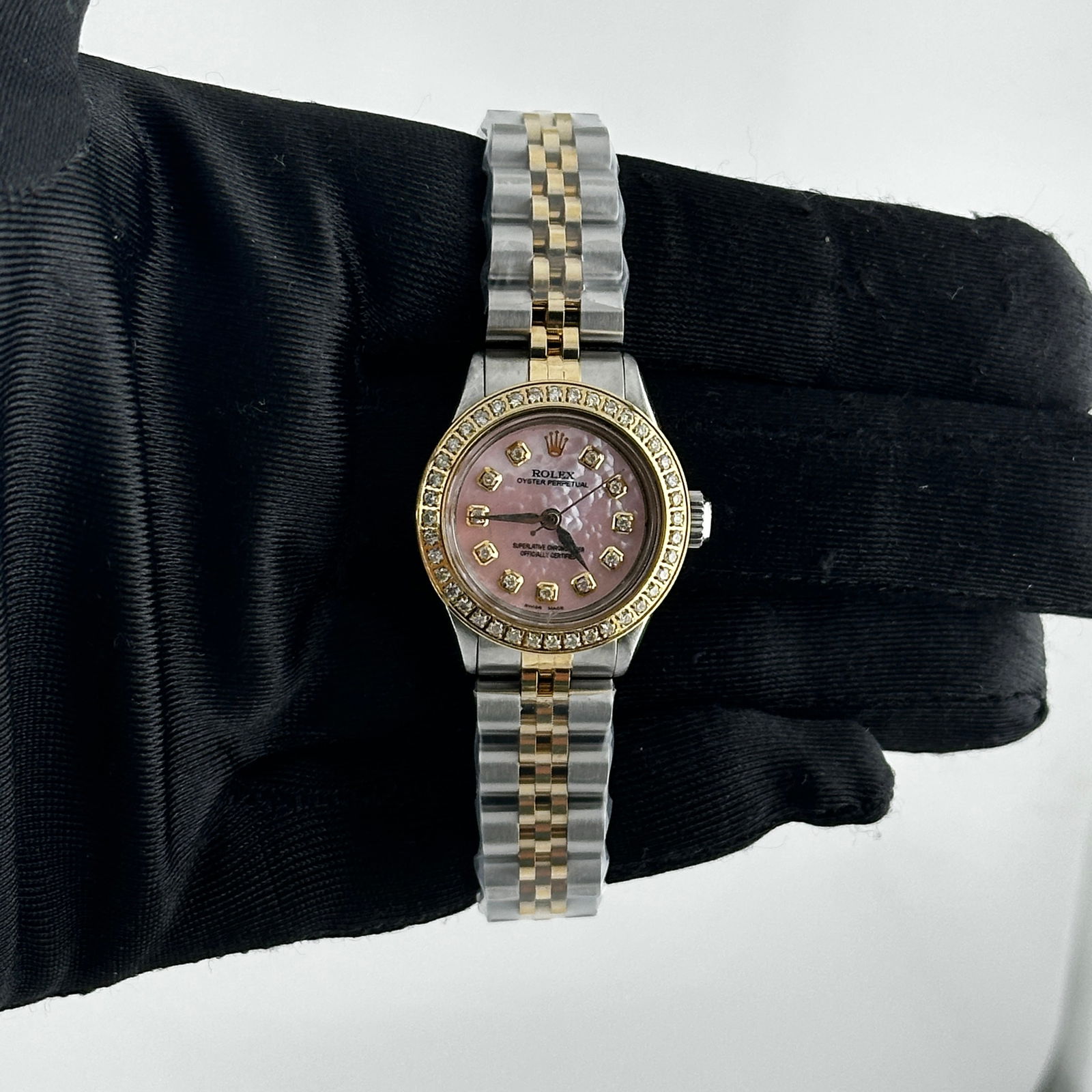 Rolex Oyster Perpetual 6410 Ladies Pink MOP Diamond Dial Jubilee Bracelet: Rolex Oyster Perpetual 6410 Ladies Pink MOP Diamond Dial Jubilee Bracelet This exquisite Rolex Oyster Perpetual watch features a stunning Aftermarket Pink Mother of Pearl diamond dial, adorned with a