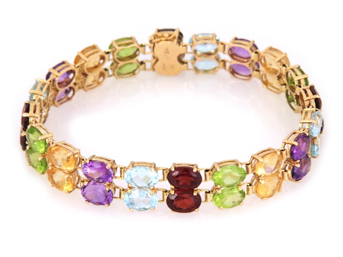 14k Yellow Gold Double Row Oval Link Bracelet with Multicolor Gemstones: 14k Yellow Gold Double Row Oval Link Bracelet with Multicolor Gemstones This stunning double row oval link bracelet is expertly crafted from 14k yellow gold and adorned with a vibrant array of multico