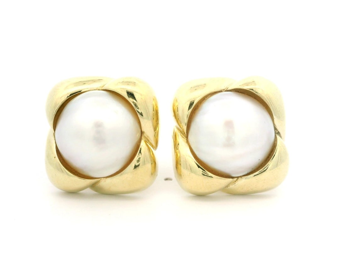 14k Yellow Gold Mabe Pearl Infinity Frame Button Earrings: 14k Yellow Gold Mabe Pearl Infinity Frame Button Earrings Elevate your elegance with these stunning 14k Yellow Gold Mabe Pearl Button Earrings. Featuring two genuine cultured Mabe pearls, each measuri