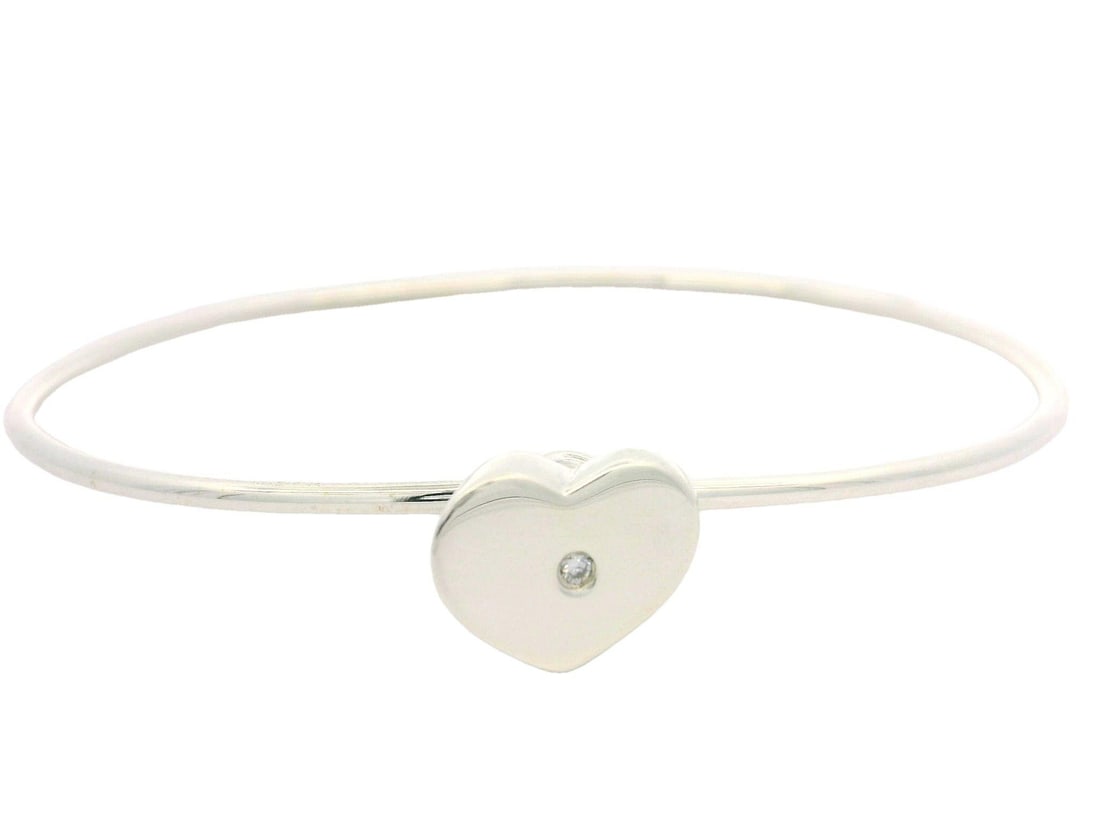 Tiffany & Co. Paloma Picasso Sterling Silver Diamond Heart Bangle: Tiffany & Co. Paloma Picasso Sterling Silver Diamond Heart Bangle This exquisite Tiffany & Co. Paloma Picasso bangle bracelet features a stunning heart hook design. Crafted from solid sterling silver,