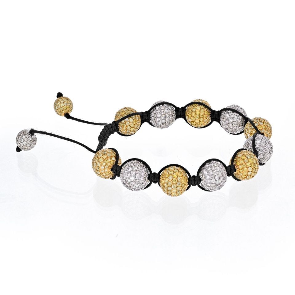 Shamballa 18K White Gold Bracelet with 40 Cts White Yellow Diamonds: Shamballa 18K White Gold Bracelet with 40 Cts White Yellow Diamonds This stunning Shamballa bracelet features a luxurious design crafted from 18K white gold. The bracelet is adorned with a beautiful c