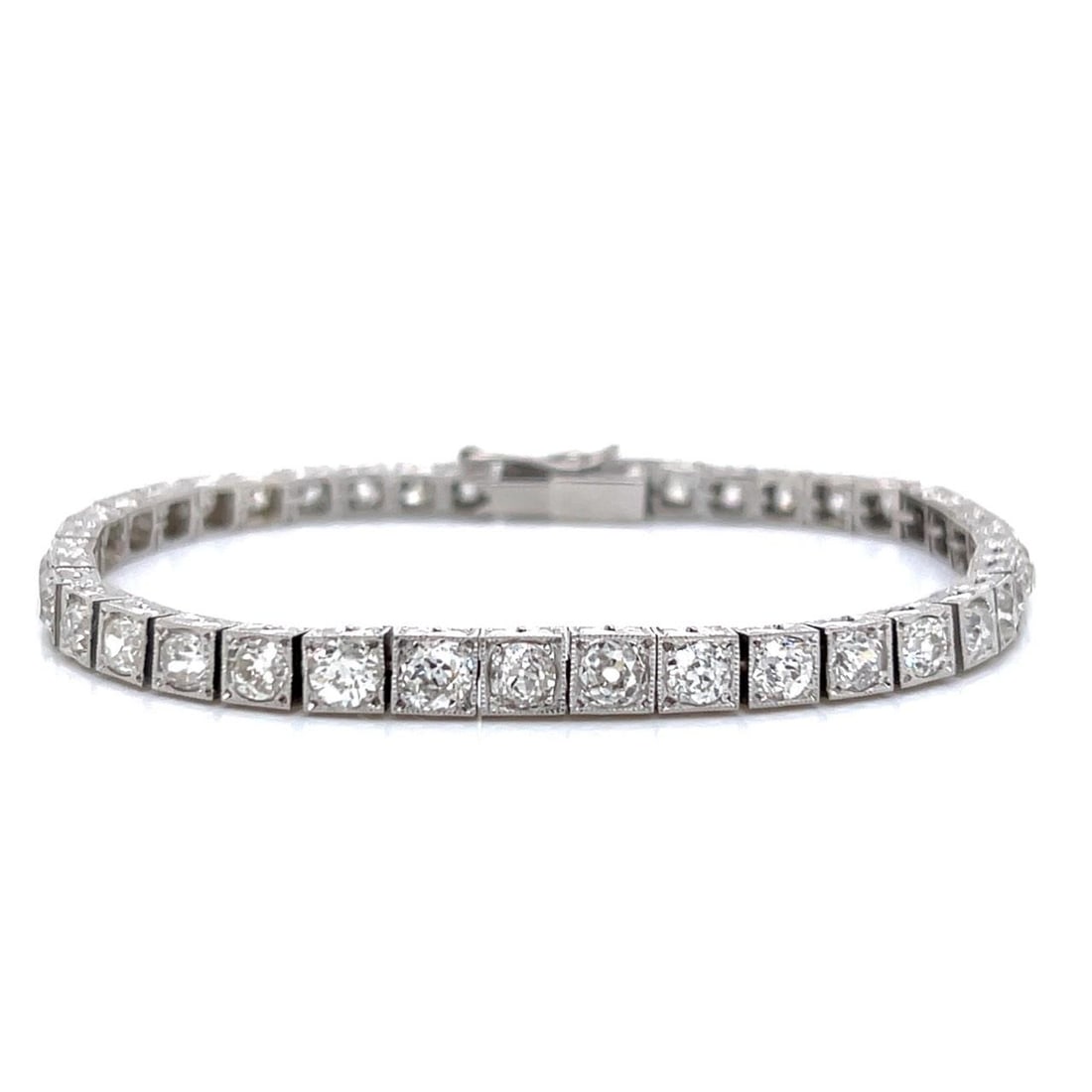Art Deco Platinum Diamond Tennis Bracelet 10.00 Ct 41 Old Cushion Cuts: Art Deco Platinum Diamond Tennis Bracelet 10.00 Ct 41 Old Cushion Cuts This exquisite Art Deco tennis bracelet is crafted in platinum and features a stunning arrangement of 41 Old Cushion-cut diamonds