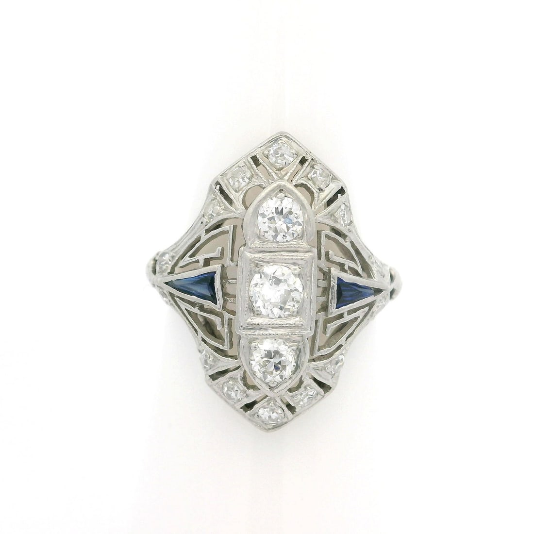 Antique Art Deco Platinum 0.75ctw Diamond Sapphire Dinner Ring: Antique Art Deco Platinum 0.75ctw Diamond Sapphire Dinner Ring This exquisite Antique Art Deco ring features a stunning combination of natural diamonds and synthetic sapphires, set in a solid platinum