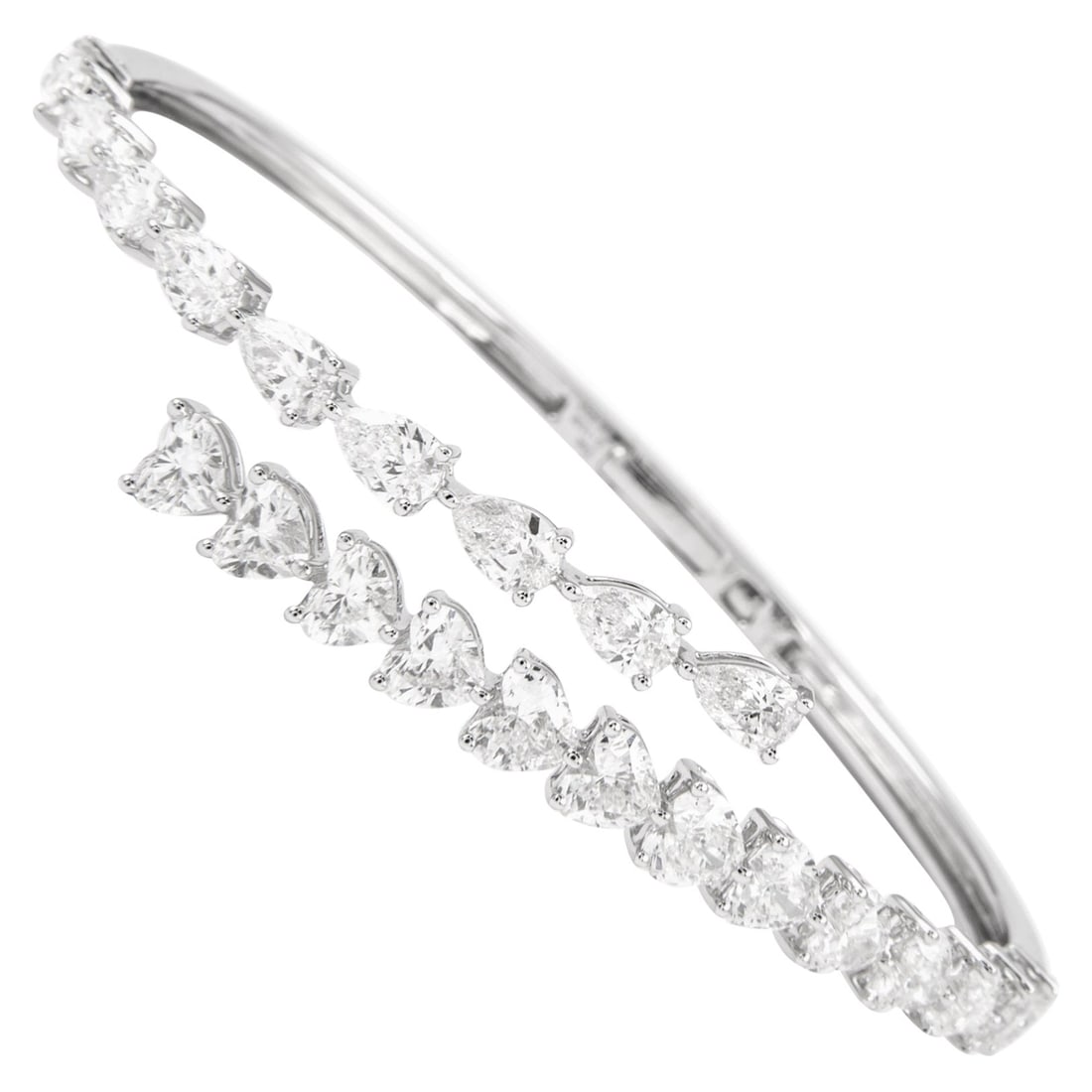 6.52ct Heart & Pear Diamond Bangle 18k White Gold: 6.52ct Heart & Pear Diamond Bangle 18k White Gold This stunning bangle bracelet showcases a total diamond weight of 6.52 carats, featuring an exquisite combination of 13 heart shape diamonds totaling