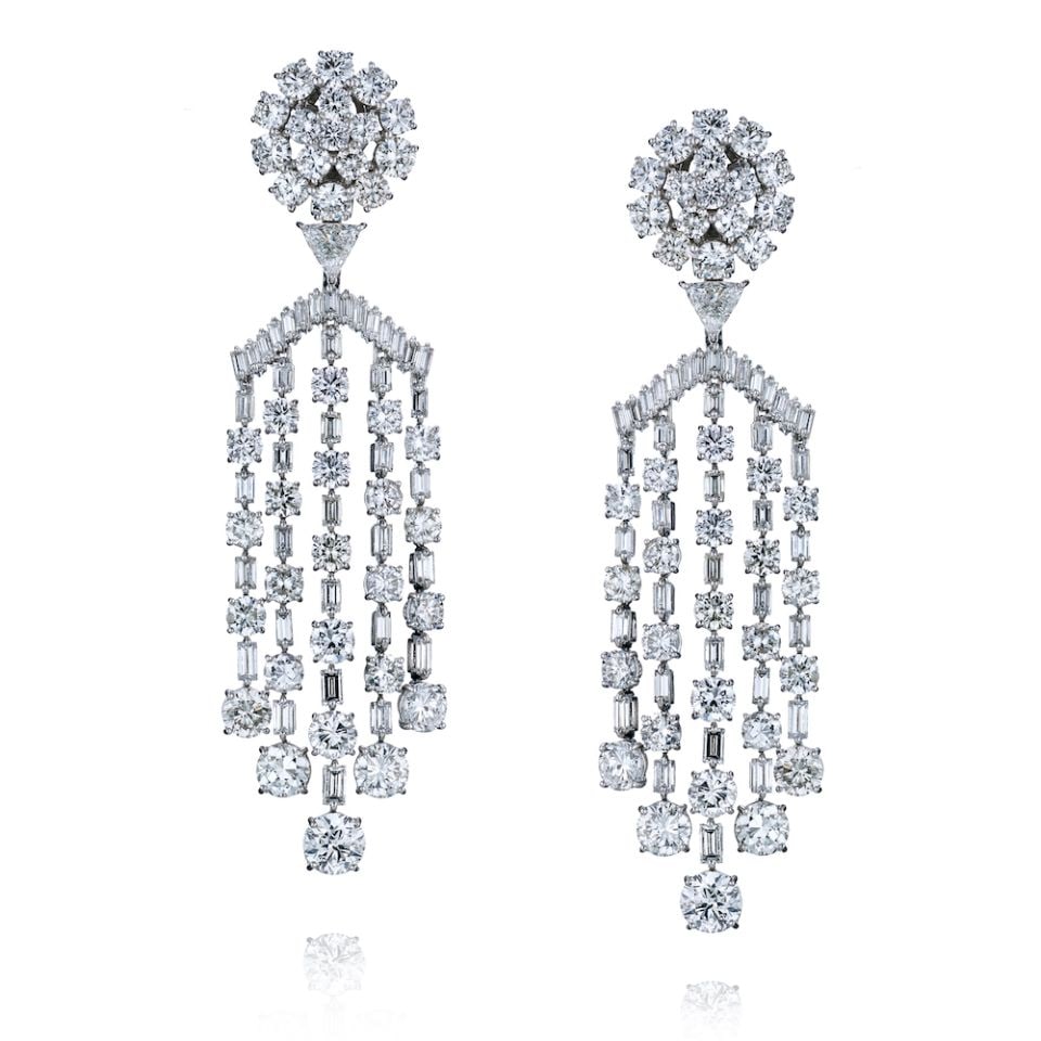 1980's Platinum Chandelier Earrings 38cttw Diamond Drop: 1980's Platinum Chandelier Earrings 38cttw Diamond Drop This exquisite pair of earrings features a breathtaking chandelier design, showcasing a dazzling array of round and baguette-cut diamonds, along