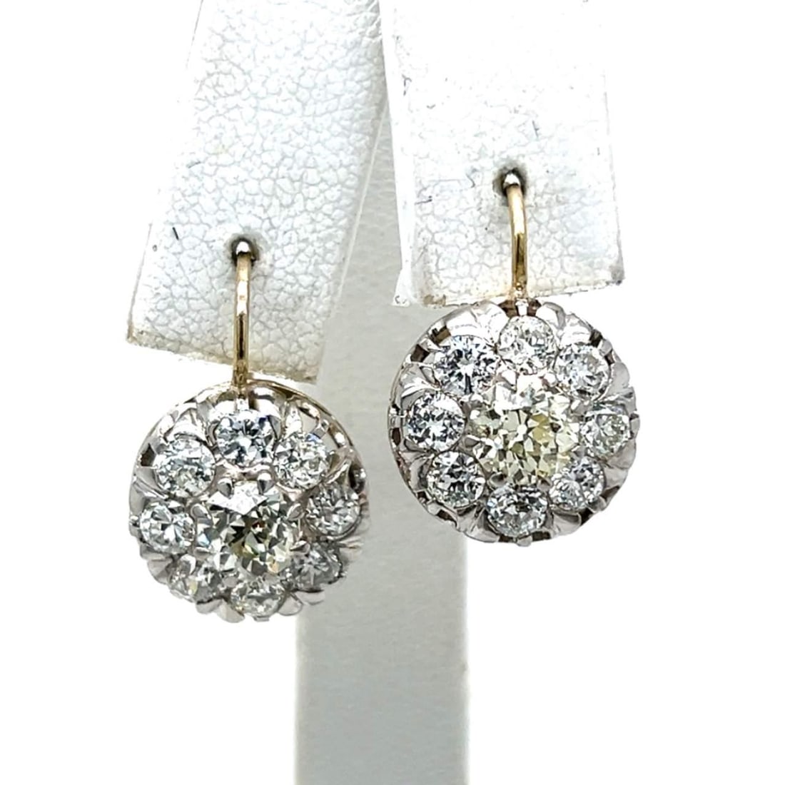 Platinum 18K Yellow Gold 3.50 Ct Old Mine Diamond Earrings: Platinum 18K Yellow Gold 3.50 Ct Old Mine Diamond Earrings Elevate your elegance with these stunning Platinum and 18K Yellow Gold Diamond Earrings, showcasing a total diamond weight of 3.50 carats. Th