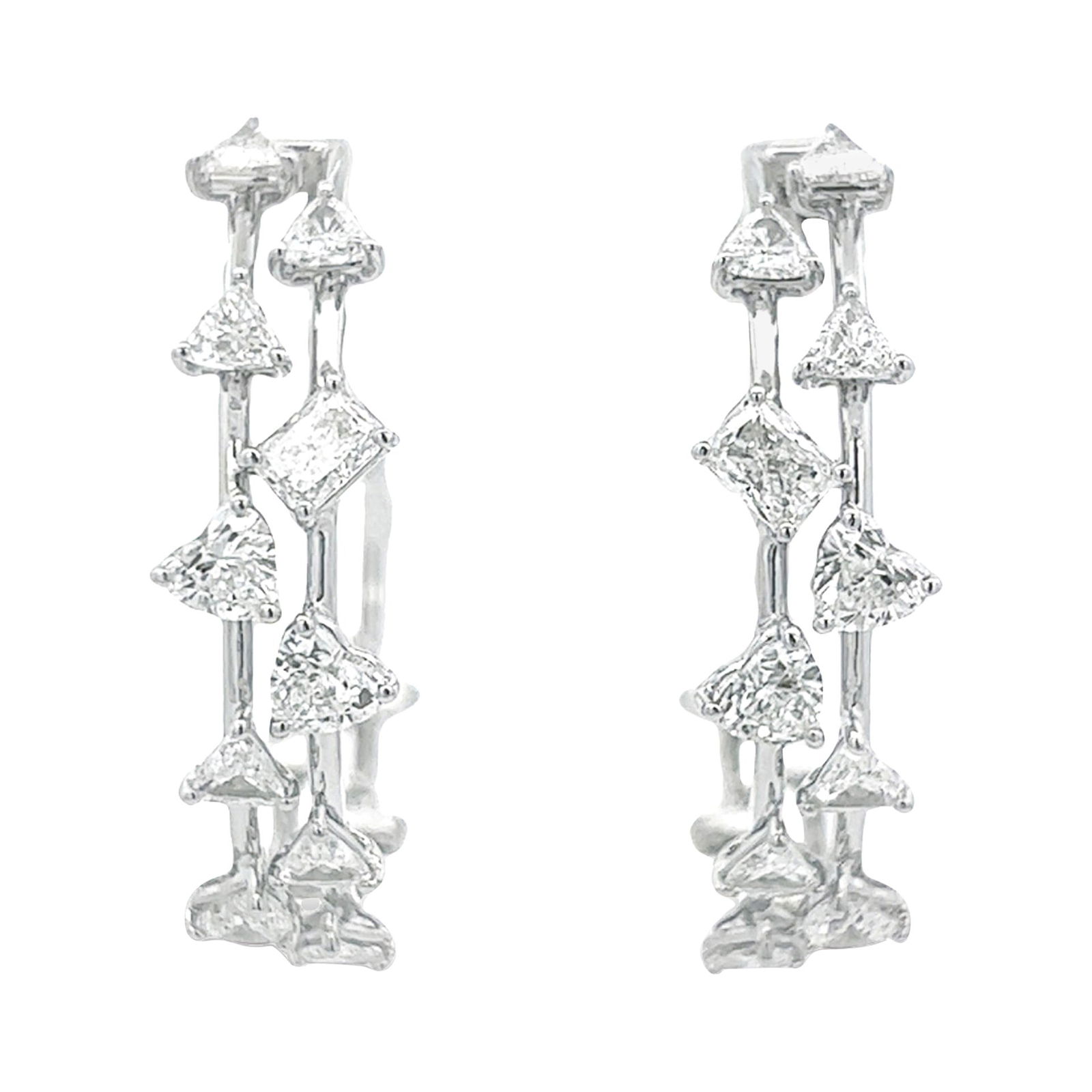 4.04ct Diamond Hoop Earrings in 18k White Gold: 4.04ct Diamond Hoop Earrings in 18k White Gold Elevate your elegance with these stunning 4.04ct Mixed Diamond Hoop Earrings, expertly crafted from 18k white gold. Featuring a unique contemporary desig
