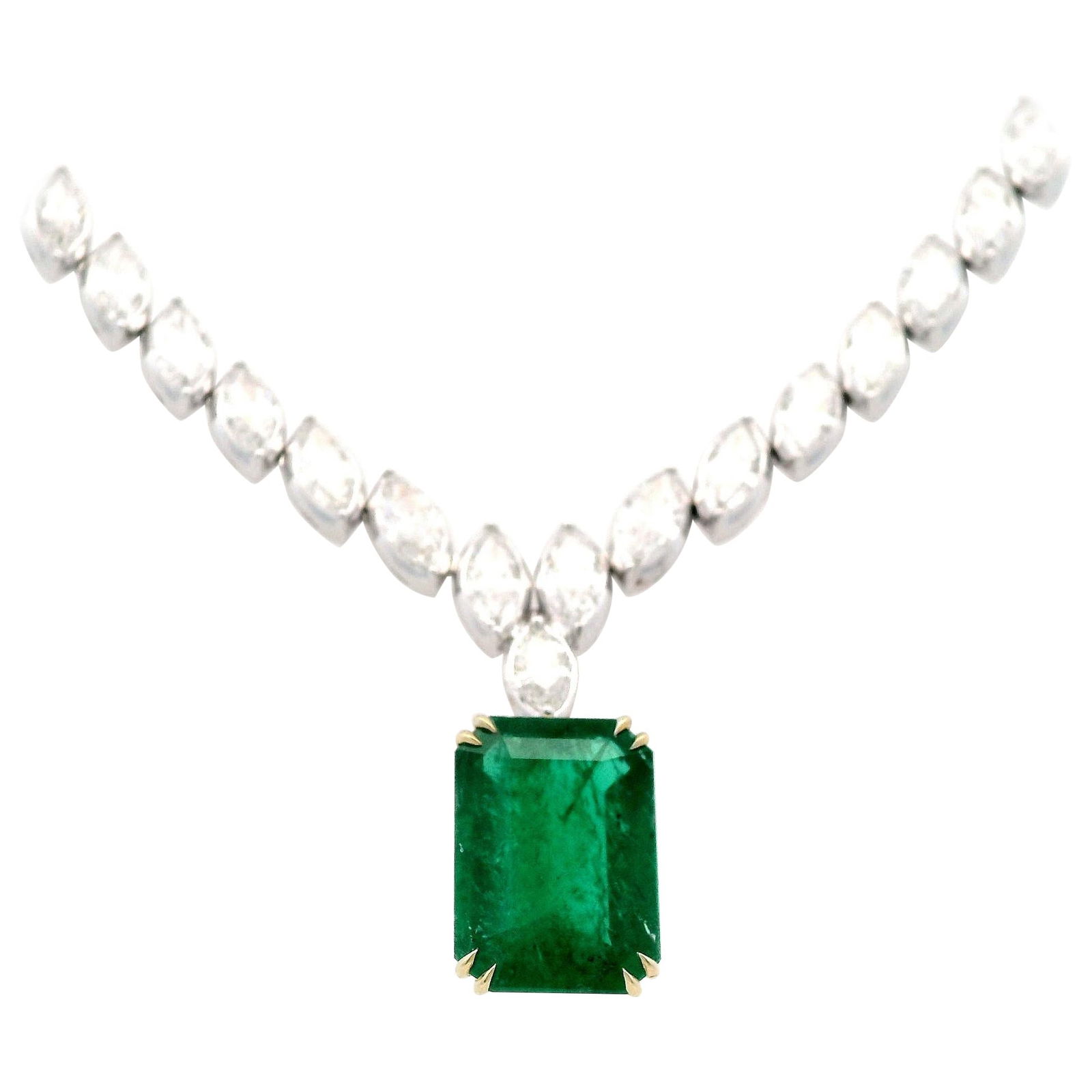 GIA 29.77ct Emerald Diamond Necklace 18k White Gold: GIA 29.77ct Emerald Diamond Necklace 18k White Gold This exquisite drop necklace features a stunning GIA certified 29.77 carat emerald, beautifully complemented by 67 marquise diamonds totaling 21.35