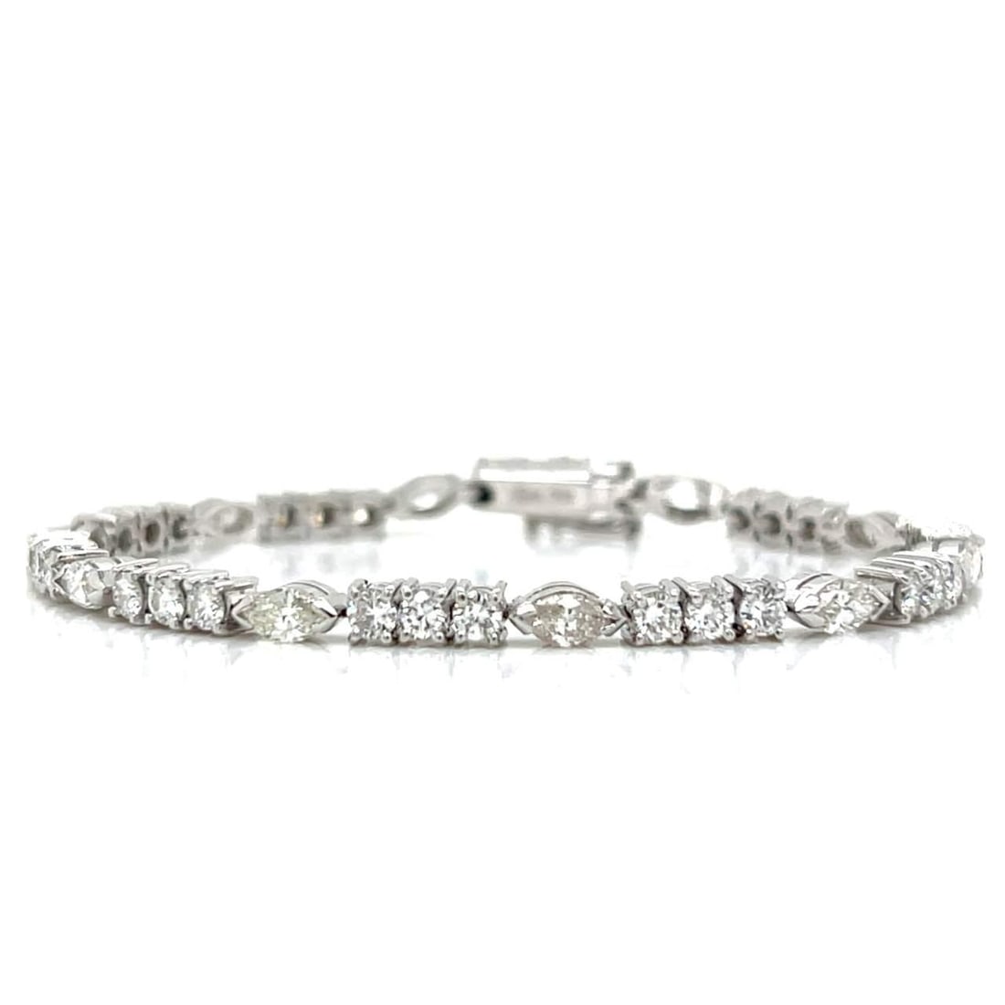 18K White Gold 3.70 Ct Diamond Bracelet with Round and Marquise Diamonds: 18K White Gold 3.70 Ct Diamond Bracelet with Round and Marquise Diamonds This exquisite bracelet features 18K white gold and showcases a stunning total diamond weight of 3.70 carats. It is adorned wit