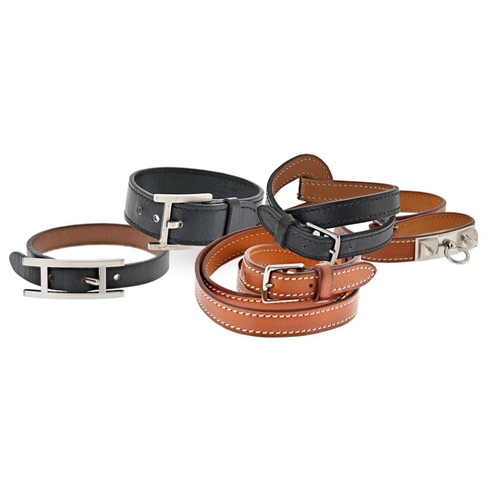 Hermes Set of 5 Genuine Leather Bracelets: Hermes Set of 5 Genuine Leather Bracelets This exquisite set includes five genuine leather bracelets by Hermes, showcasing the brand's signature craftsmanship. Each bracelet is designed for elegance a