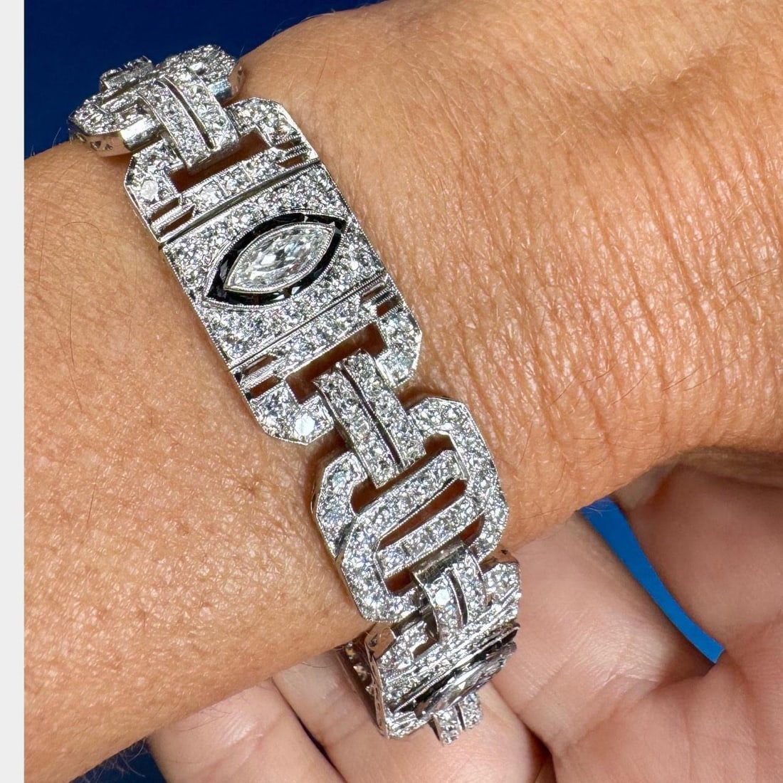 Art Deco Platinum Diamond Bracelet 12.80 Ct with Black Onyx: Art Deco Platinum Diamond Bracelet 12.80 Ct with Black Onyx This exquisite Art Deco bracelet is crafted in platinum and showcases a stunning arrangement of diamonds totaling approximately 12.80 carats