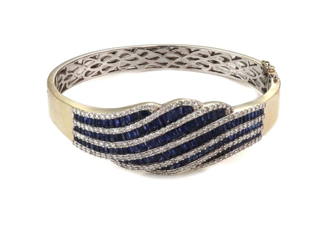 Stunning 18k Gold Diamond Sapphire Bracelet 17 Carats 8.25 Inch: Stunning 18k Gold Diamond Sapphire Bracelet 17 Carats 8.25 Inch This exquisite bracelet features a stunning design crafted from 18k pale yellow and white gold. It includes a secure hinged mechanism an