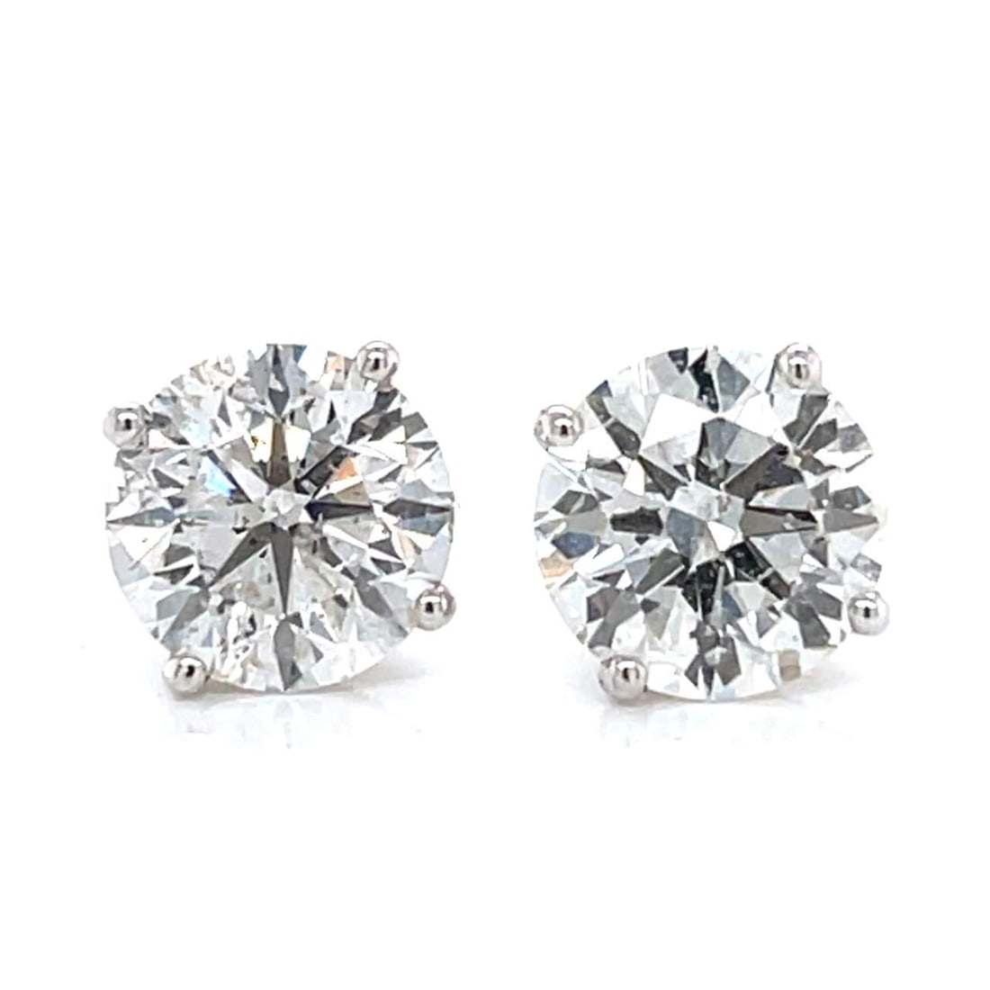 14K White Gold 5.43 Ct Diamond Stud Earrings H-I Color SI2-I1 Clarity: 14K White Gold 5.43 Ct Diamond Stud Earrings H-I Color SI2-I1 Clarity These stunning 14K white gold diamond stud earrings feature a total diamond weight of 5.43 carats, showcasing two exquisite diamon