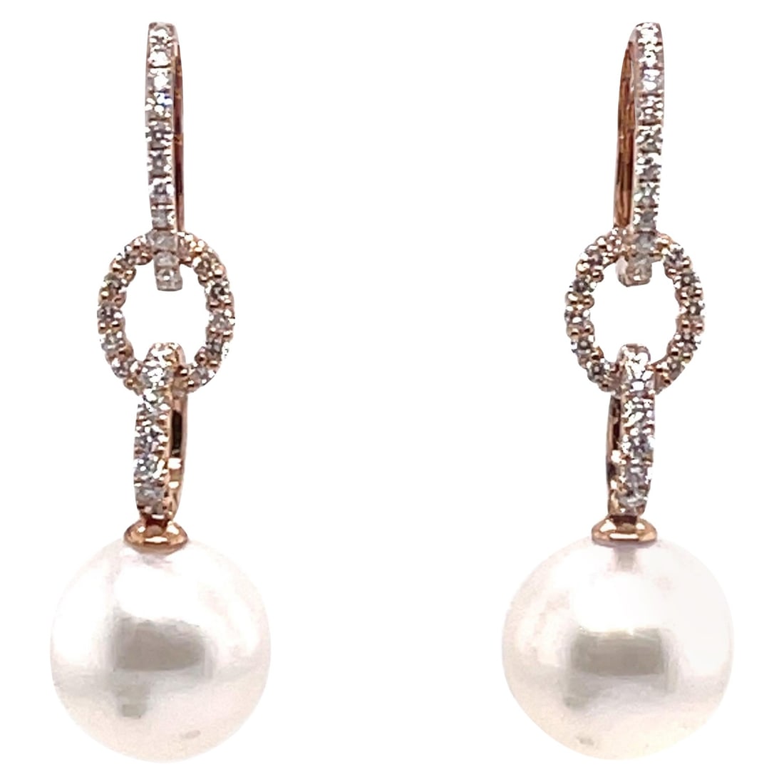 18K Rose Gold Drop Hoop Earrings with South Sea Pearl and Diamond: 18K Rose Gold Drop Hoop Earrings with South Sea Pearl and Diamond These exquisite 18K Rose Gold Drop Hoop Earrings feature a contemporary design, showcasing a beautiful combination of white diamonds a