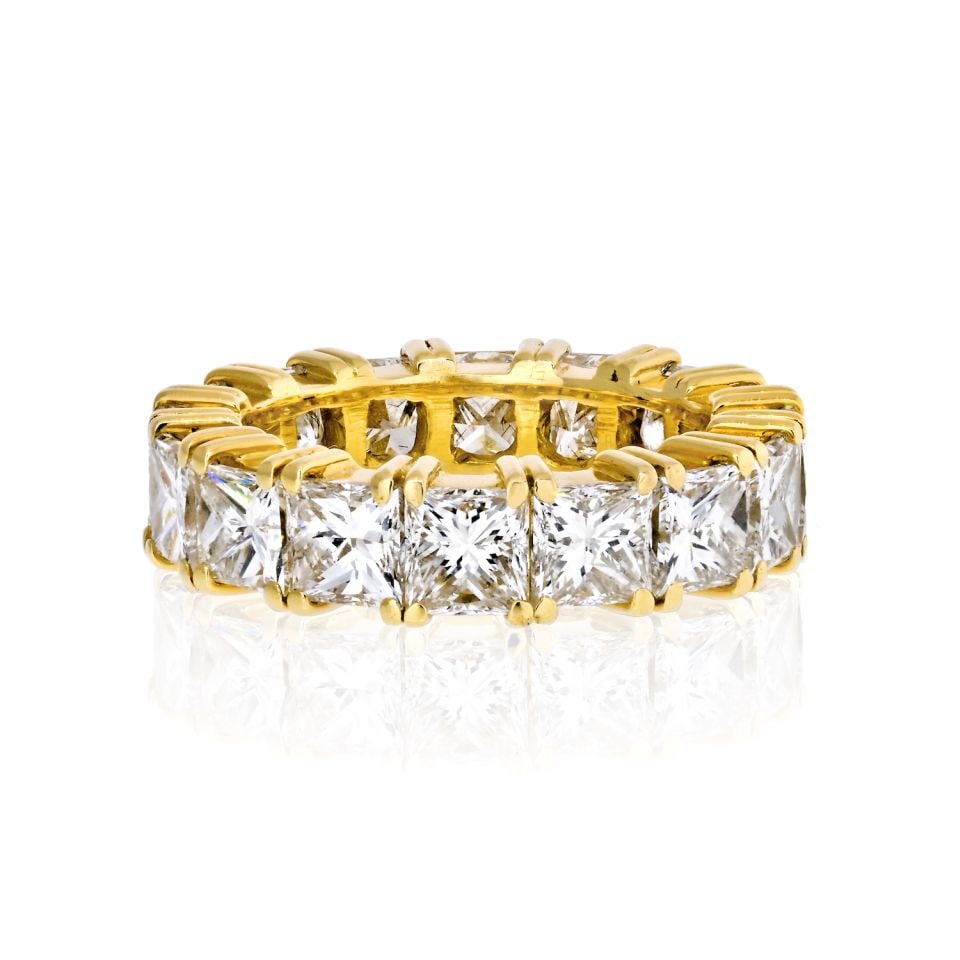 18K Yellow Gold 8 Carat Princess Cut Diamond Eternity Band: 18K Yellow Gold 8 Carat Princess Cut Diamond Eternity Band This exquisite 18K yellow gold eternity band showcases a stunning array of 16 princess cut diamonds, totaling 8.00 carats, that encircle the