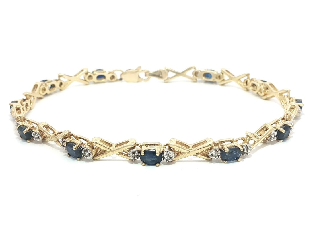 14k Yellow Gold 2.5ctw Oval Sapphire Round Diamond Bracelet: 14k Yellow Gold 2.5ctw Oval Sapphire Round Diamond Bracelet This exquisite bracelet features a stunning arrangement of natural gemstones set in 14K solid yellow gold. It showcases 11 oval brilliant cu