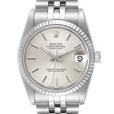 Rolex Datejust Ladies Silver Dial Jubilee Ref 68274 with Warranty Papers 1992: Rolex Datejust Ladies Silver Dial Jubilee Ref 68274 with Warranty Papers 1992 This exquisite Rolex Datejust watch features a stunning silver dial and a classic fluted bezel, designed specifically for