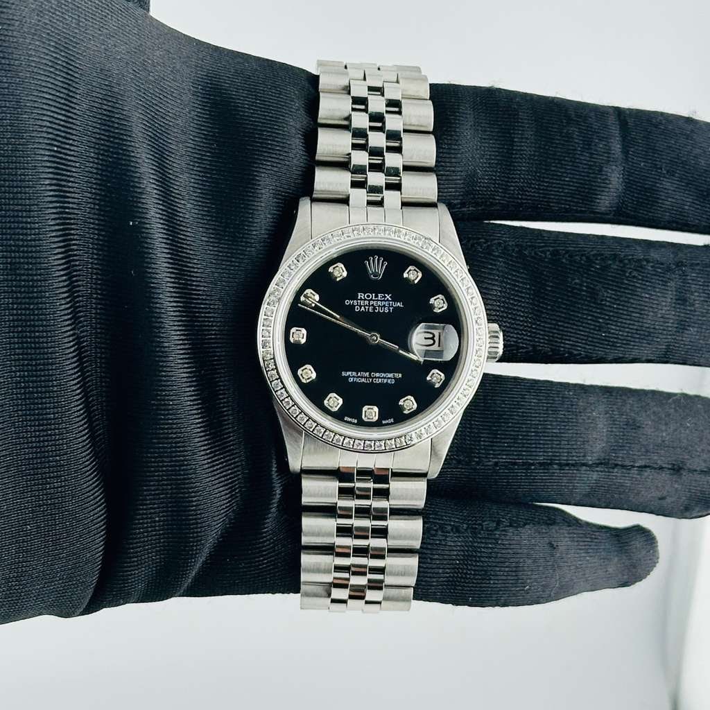 Rolex Datejust 16014 Aftermarket Black Diamond Dial Jubilee Bracelet: Rolex Datejust 16014 Aftermarket Black Diamond Dial Jubilee Bracelet This exquisite Rolex Datejust features a striking After Market Green Roman dial, complemented by an engine-turned bezel and a luxur