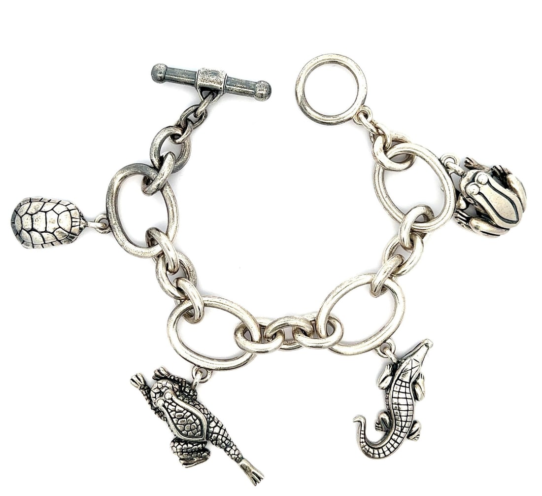 Kieselstein Vintage Sterling Silver Charm Bracelet with Crocodile Turtle Frog: Kieselstein Vintage Sterling Silver Charm Bracelet with Crocodile Turtle Frog This Vintage Kieselstein Cord charm bracelet features a playful design with crocodile, turtle, and frog charms, crafted fr