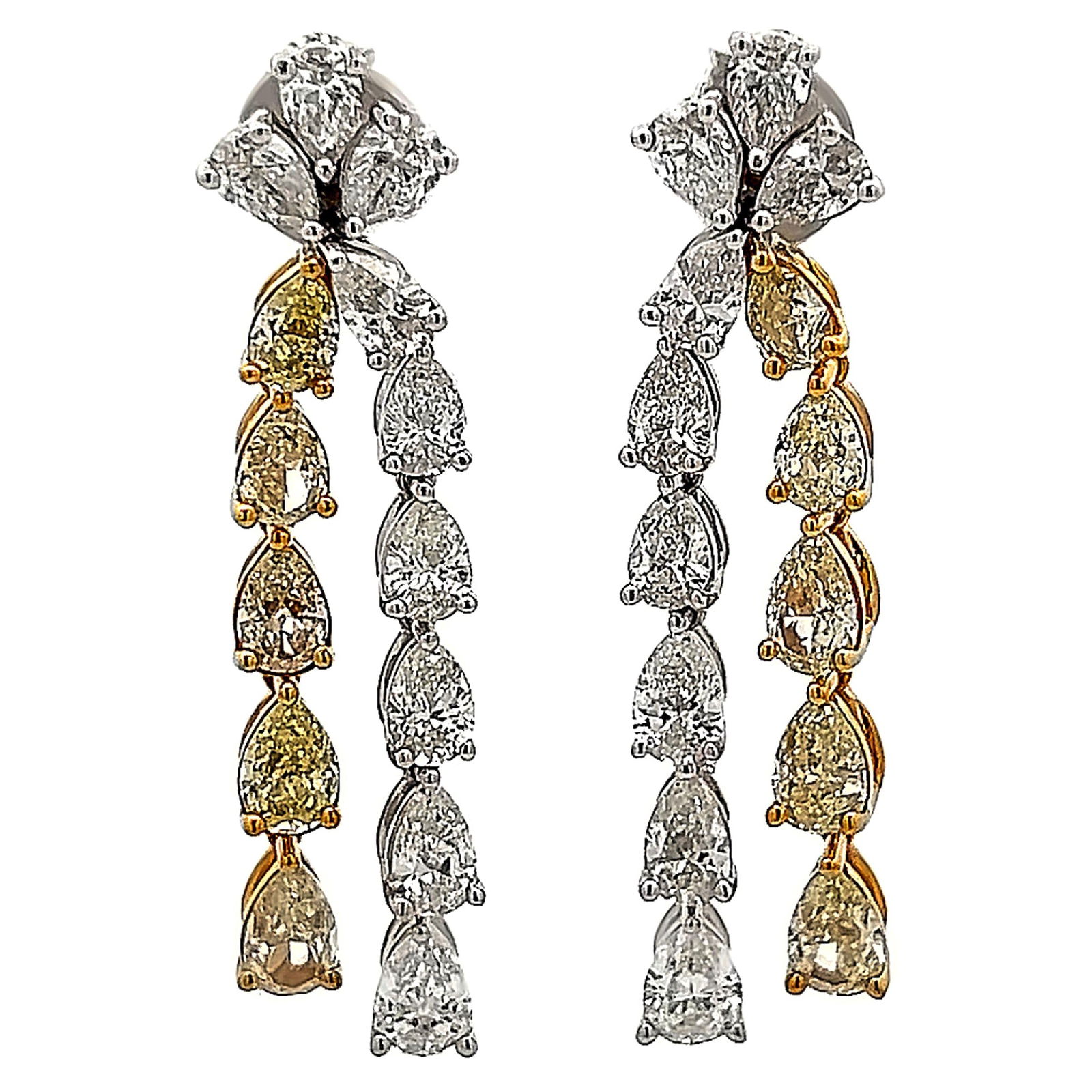 8.43ct Fancy Yellow White Diamond Drop Earrings 18k Gold: 8.43ct Fancy Yellow White Diamond Drop Earrings 18k Gold These exquisite drop earrings showcase a stunning combination of fancy yellow and white diamonds, totaling 8.43 carats. Crafted from luxurious