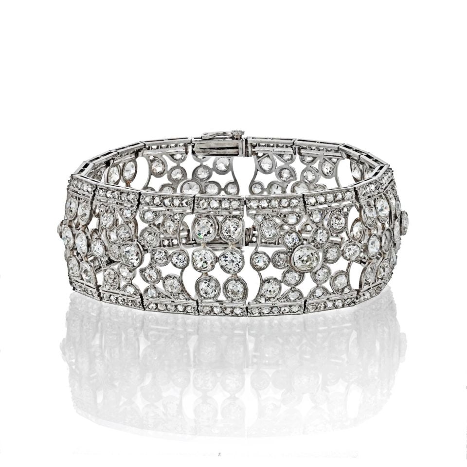 Circa 1940s Platinum Openwork Bracelet with 35 Carat Diamonds: Circa 1940s Platinum Openwork Bracelet with 35 Carat Diamonds This exquisite bracelet, crafted in the 1940s, showcases a stunning openwork design made from platinum. It is adorned with 316 old cut dia