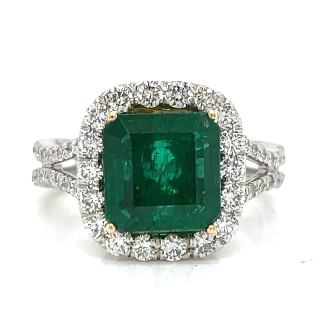 Platinum Emerald 3.30 Ct and Diamond 1.10 Ct Ring: Platinum Emerald 3.30 Ct and Diamond 1.10 Ct Ring This exquisite ring features a stunning emerald weighing approximately 3.30 Ct, beautifully complemented by 1.10 Ct. of sparkling diamonds. The diamon