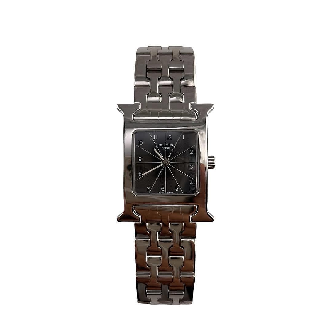 Heure H Stainless Steel Watch by Hermes Reference HH1.210 with 2002 Papers: Heure H Stainless Steel Watch by Hermes Reference HH1.210 with 2002 Papers The Hermes Heure H watch features a black dial and stainless steel case, measuring 21x30mm. This timepiece comes with origina