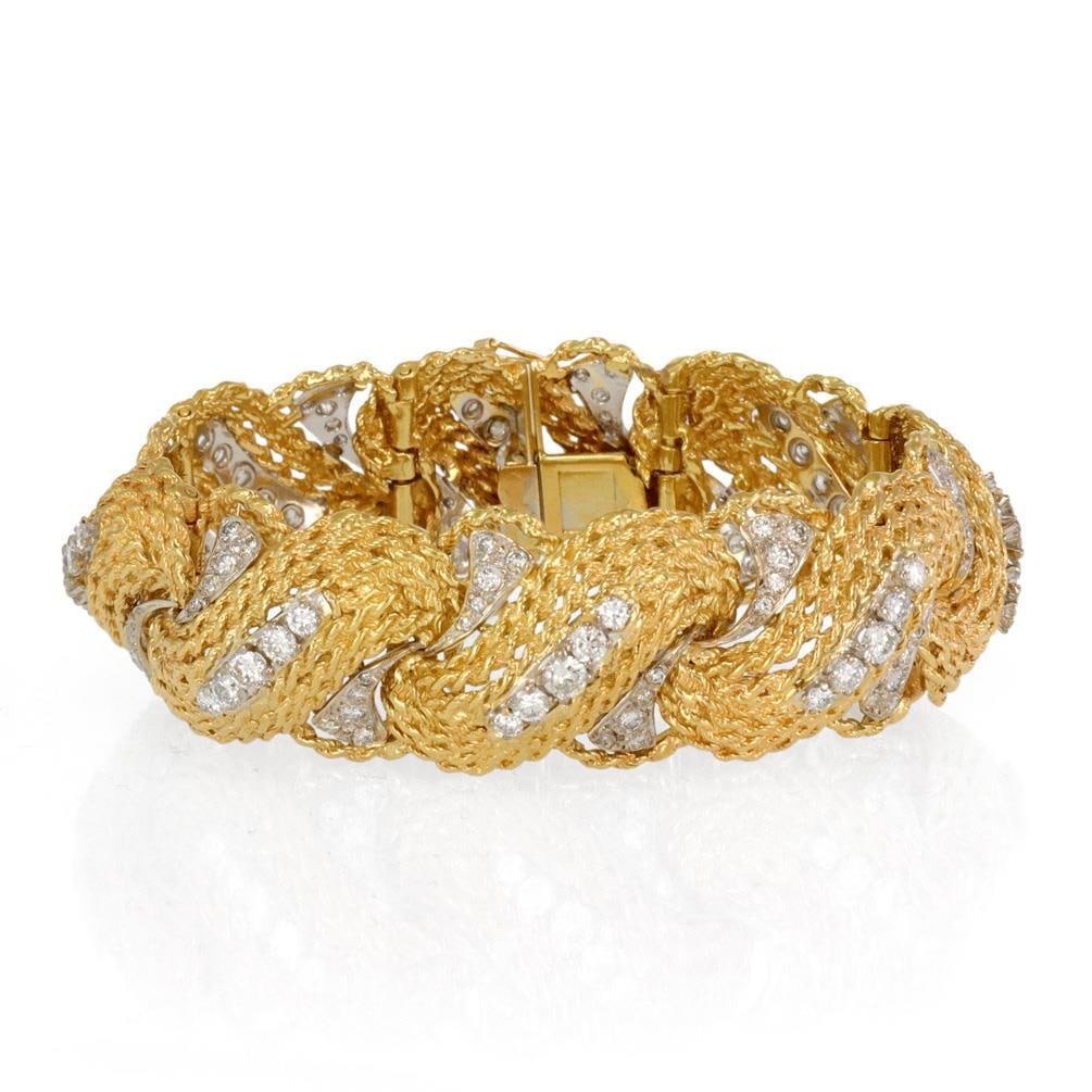 Elegant 6.5ct Diamond 18k Two Tone Gold Estate Bracelet: Elegant 6.5ct Diamond 18k Two Tone Gold Estate Bracelet This stunning estate bracelet showcases a sophisticated design crafted from 18k yellow and white gold. The bracelet features long, curved, textu