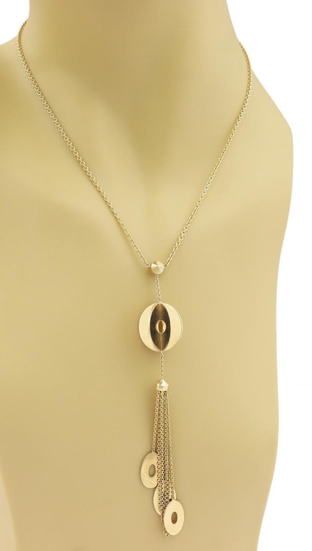 14k Yellow Gold Geometric Lariat Necklace with Tassel Pendant: 14k Yellow Gold Geometric Lariat Necklace with Tassel Pendant Elevate your jewelry collection with this stunning lariat necklace, meticulously crafted from 14k yellow gold with a polished finish. The