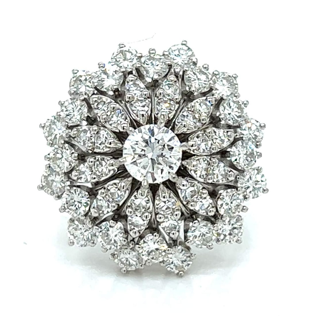 1950s 14K White Gold Diamond Ring with 48 Total Diamonds: 1950s 14K White Gold Diamond Ring with 48 Total Diamonds This exquisite 1950's ring is crafted from 14K white gold and features a stunning center diamond weighing approximately 0.55 Ct, boasting an E-