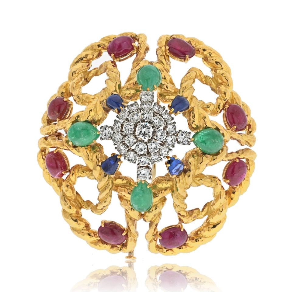 David Webb Platinum 18K Gold Multigem Emerald Ruby Diamond Brooch Pendant: David Webb Platinum 18K Gold Multigem Emerald Ruby Diamond Brooch Pendant This exquisite brooch by David Webb features a stunning combination of platinum and 18K yellow gold, showcasing a vibrant arra