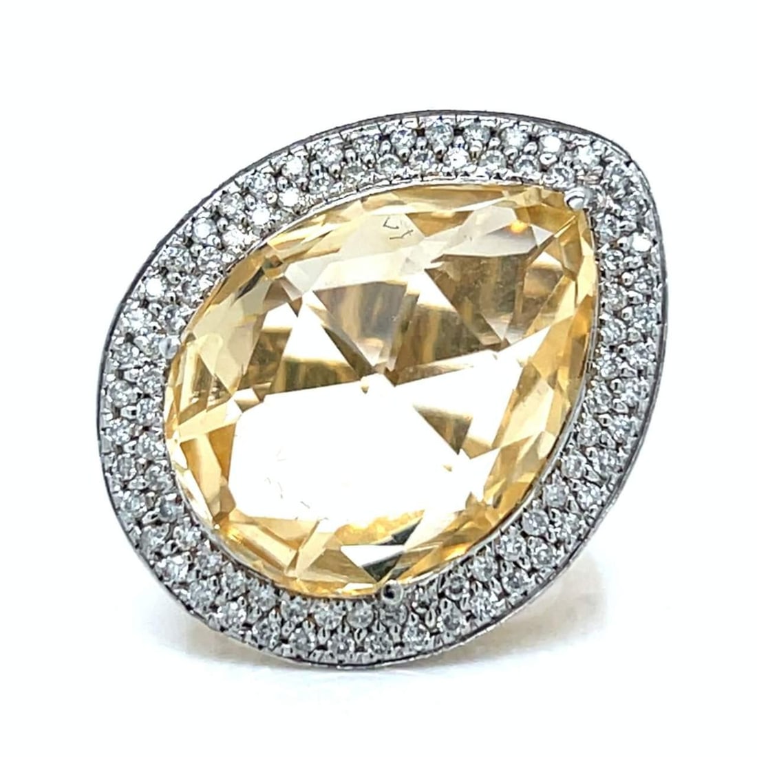 14K Yellow Gold Topaz 15.00 Ct Diamond Ring: 14K Yellow Gold Topaz 15.00 Ct Diamond Ring This exquisite 14K Yellow Gold ring features a stunning arrangement of gemstones. It showcases an approximate 15.00 Ct. Topaz, complemented by around 1.00 C