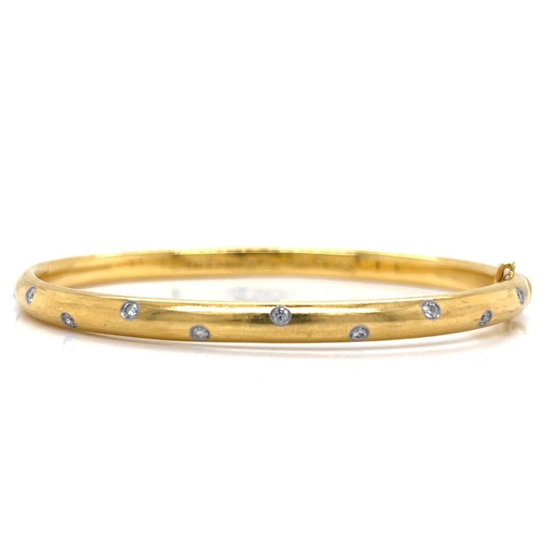 Tiffany & Co. 18K Gold Platinum Diamond Bangle Bracelet 0.40 Ct: Tiffany & Co. 18K Gold Platinum Diamond Bangle Bracelet 0.40 Ct This exquisite bangle bracelet from Tiffany & Co. features a luxurious combination of 18K yellow gold and platinum, elegantly adorned wi