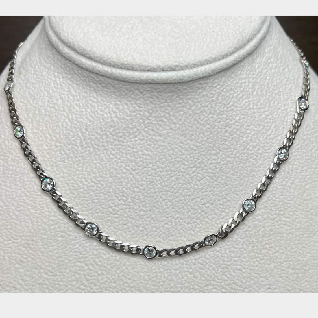 14k White Gold Cuban Link Diamond Necklace 4.80 Ct G-H VS2-SI2: 14k White Gold Cuban Link Diamond Necklace 4.80 Ct G-H VS2-SI2 This stunning 14k White Gold Cuban Link Necklace features a unique 'by the yard' design. It is adorned with 16 sparkling diamonds, with a