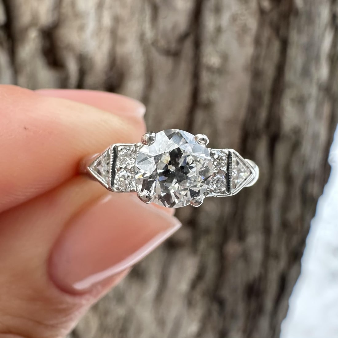 Antique Art Deco Platinum 1.23ctw Diamond Trillion Engagement Ring: Antique Art Deco Platinum 1.23ctw Diamond Trillion Engagement Ring This exquisite Antique Art Deco engagement promise ring features a stunning design crafted in solid platinum. The centerpiece is a na