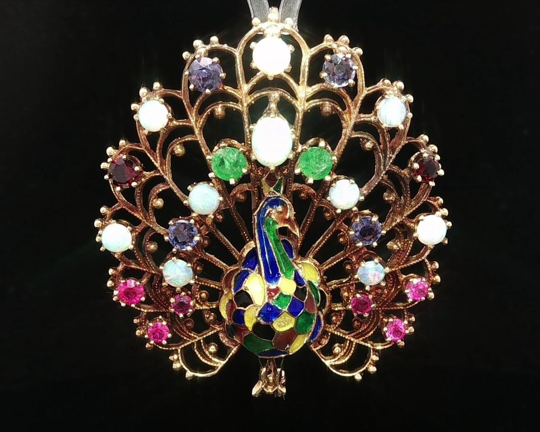 Vintage 14k Yellow Gold Multi Stone Peacock Brooch Pendant: Vintage 14k Yellow Gold Multi Stone Peacock Brooch Pendant This exquisite vintage brooch pendant features a stunning array of natural gemstones, including opal, emerald, garnet, and pink and blue sapp