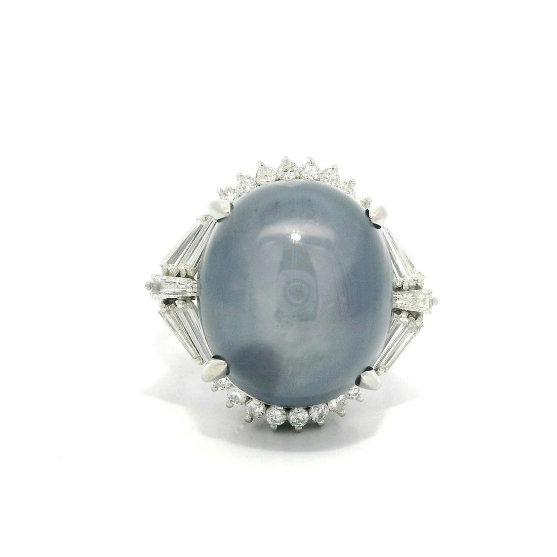 Platinum 24.44ctw Star Sapphire Baguette Diamond Statement Ring Size 7: Platinum 24.44ctw Star Sapphire Baguette Diamond Statement Ring Size 7 This stunning statement ring features a large 23.74ct natural genuine star sapphire in a captivating grayish blue color, elegantl